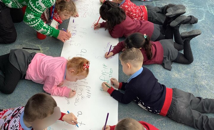 Image of We are having plenty of fun at our Pen Party today, practicing writing ‘p’.