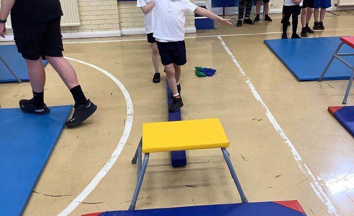 Image of Our topic this term in PE is gymnastics. We are very lucky to have Blackburn Rovers lead this session. We performed different stretches to warm our bodies up, then used the equipment to balance, throw and jump. Great effort Year 2!