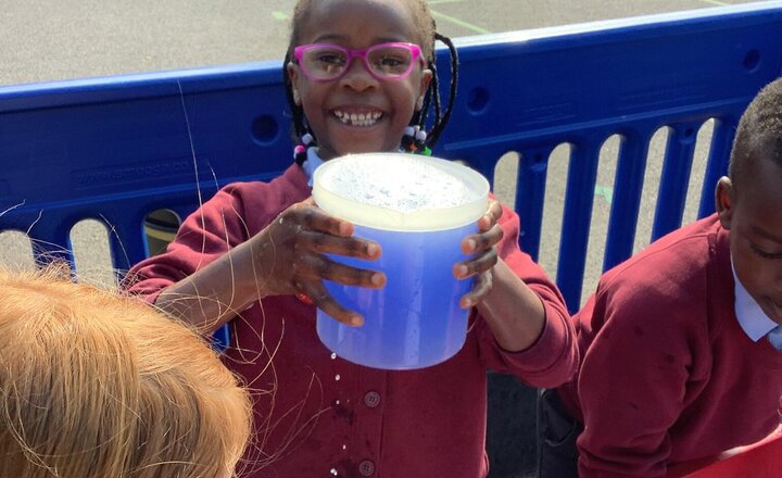 Image of In our outdoor area, we have been using the water tray to help us with our Maths! We have been looking at capacity and using the words full, nearly full, nearly empty and empty.