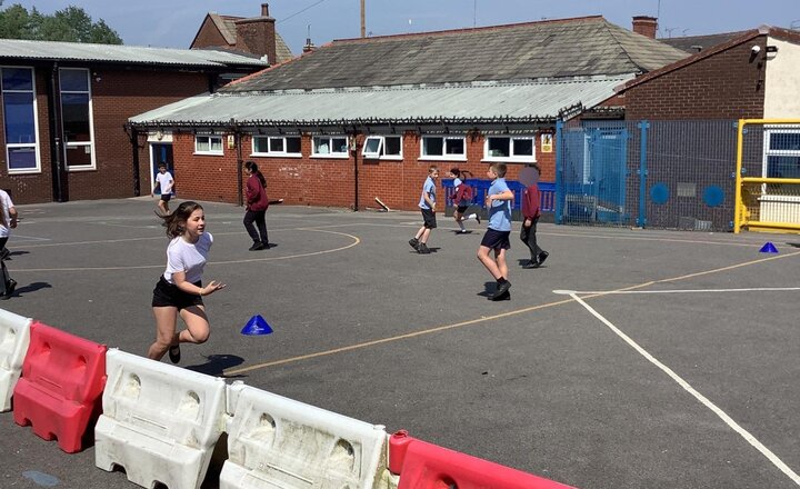Image of In PE yesterday we continued our striking & fielding unit, finishing with a very competitive game of Football Rounders!