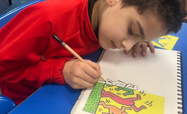 Image of With Mrs Hargreaves this afternoon we have been working on creating our own interpretations of the artist, Keith Haring. We have taking pride in our sketch books and learning the art of sketching.