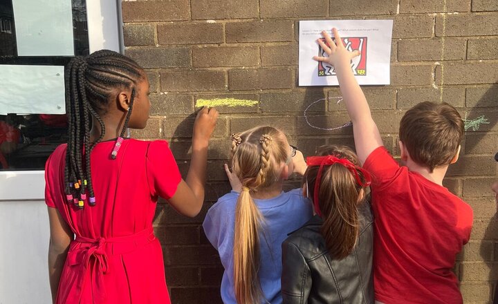 Image of We have working in the way of Keith Haring. Creating art in his style outside in the playground and on the side path. Don’t forget to come and have a look at what we have created. Let us know what you think at hometime tonight on the yard.