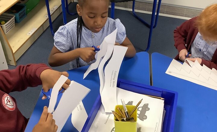 Image of We then looked at our skills! We practised cutting and drawing ready for the real card! We picked the nursery rhyme we are going to use and followed step by step instructions!