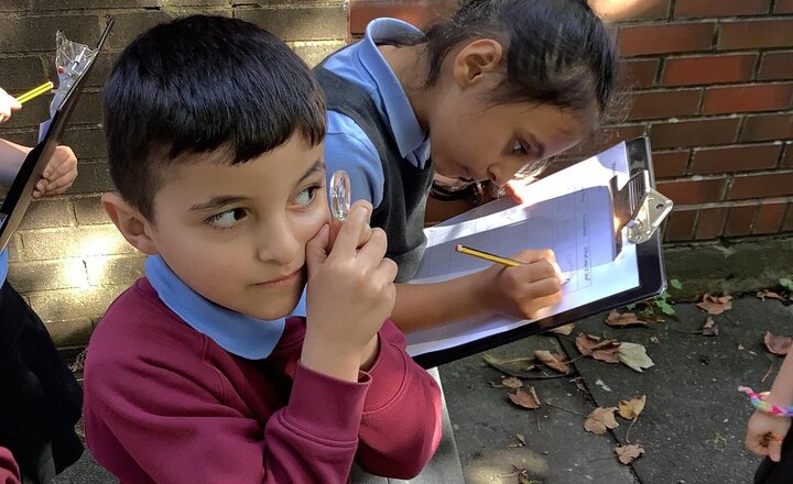 Image of Our topic this term in Science is Living Things and Their Habitats. Yesterday we went to investigate what microhabitats we could find on our school grounds. The children loved exploring using their magnifying glass.