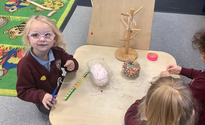 Image of Interfaith week- Sikhism. We read the story of Guru Nanak and the Missing Money and discussed helping others and friendship. We then made friendship bracelets.
