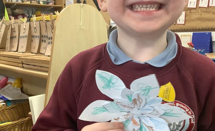 Image of Interfaith week- Day 4: Buddhism. We read the story of The Monkey King and discussed peace and mindfulness. We made Lotus flowers because they are a symbol of purity, spiritual awakening, and enlightenment.