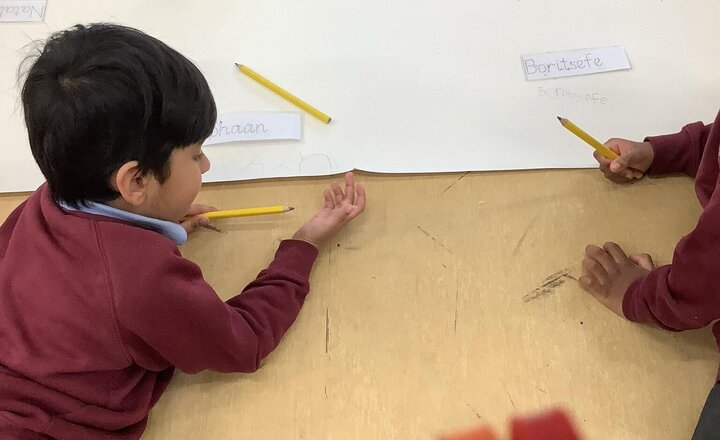 Image of Practising writing our names in pen party today.