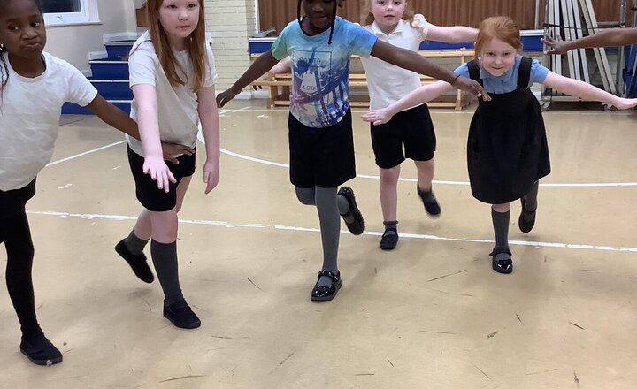 Image of Jungle Yoga in PE After warming up with Touchdown, we used breathing techniques to hold still animal poses. To finish, groups invented their own unique yoga moves.