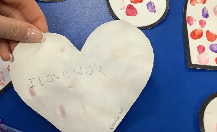 Image of In Art we understood how we can use different parts of our body to create artwork!  We focused on using our finger prints using different colours for the theme of Valentine’s Day to make cards for loved ones.