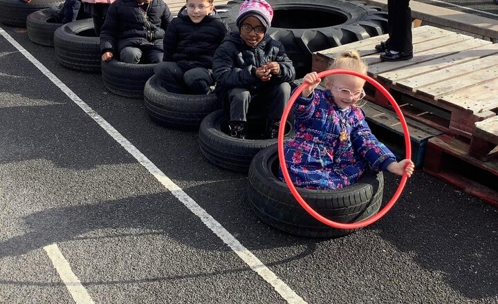 Image of Reception working super hard as a team to make a bus, with 2 drivers for different places!