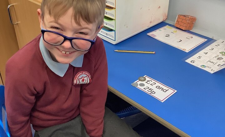 Image of In Maths, we’re moving from counting pounds and pence to making the same amount. Please help us make this vital life skill "stick" by practicing at home—counting coins or playing shops is a brilliant way to support your child's learning!