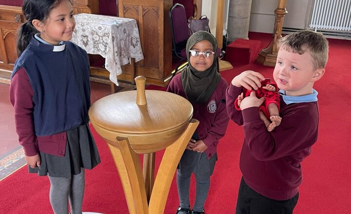 Image of Year 1 visited church to learn about baptism with Reverend Alice. We staged a ceremony with Baby Lily, exploring the font and the roles involved. Lily even received a certificate and candle! Thank you, Reverend Alice for making our learning fun!