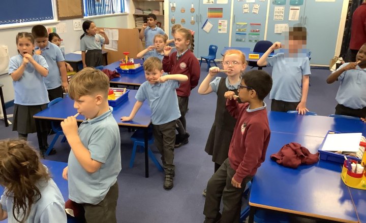 Image of Keeping our teeth clean and healthy in our first teeth brushing session!