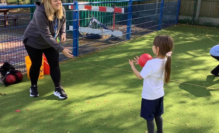 Image of We took PE outside for some fresh air! We started by warming up Supertato style and recapped our learning from last week. Then, we moved on to underarm throwing and bouncing with a partner! The children worked really hard and did a fantastic job!