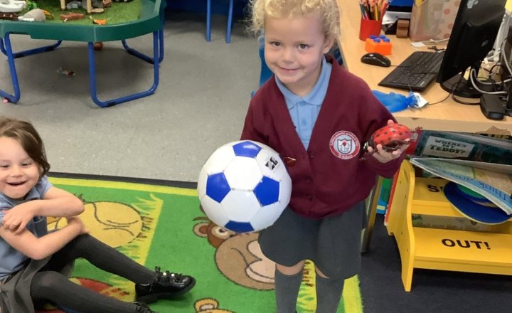 Image of In Maths, we have been learning about size, mass with our human weighing scale and capacity! We even found that the children are small enough to fit in the big box! ⭐️