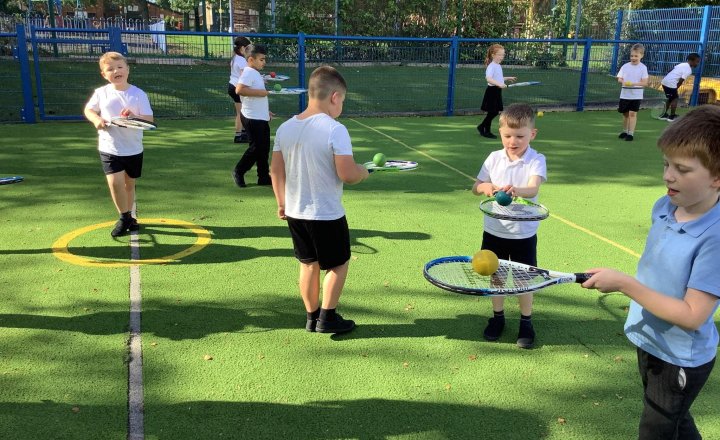 Image of Balancing Balls 🏈  We have been trying really hard to balance balls on our rackets today in PE. What an important skills we have begun to master.  Thanks Sam and Mrs Daly for helping us