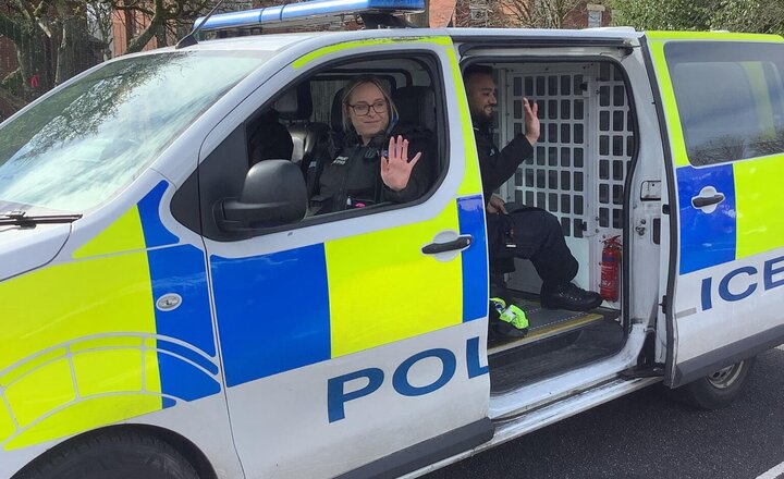 Image of This term we have been learning about people who help us. We had a special visitor in today, Kirsty the Police Officer! Reception tried on some Police uniforms and even found Bob who stole my ring, in the back of the van!