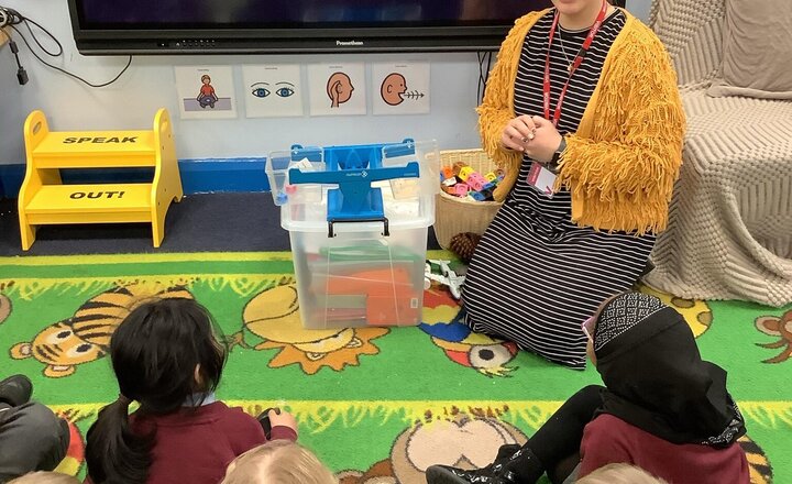 Image of Enjoying a book by Reception in the reading area.