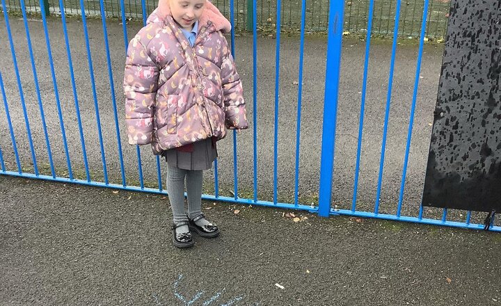 Image of Enjoying mark making outside today.
