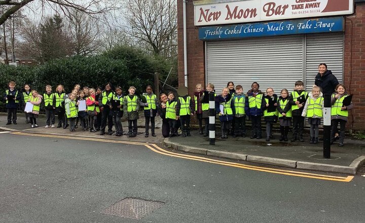 Image of We have been so lucky to go on two local walks this week.  On Tuesday we went out out looking at the human and physical features of Mill Hill for our Geography topic. Here we are on our Science walk yesterday looking for wooden materials outdoors.