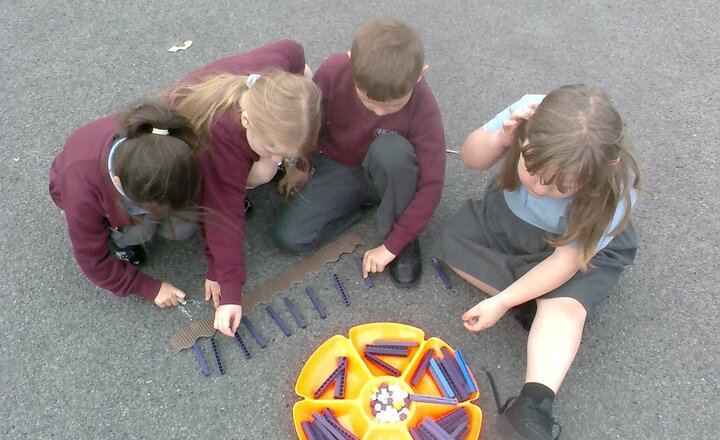 Image of We have been creating our own number lines in maths on Friday afternoon with Mrs Hargreaves. We created our own number lines using base 10 and numicon and then labelled them in chalk. Our learning continued inside.