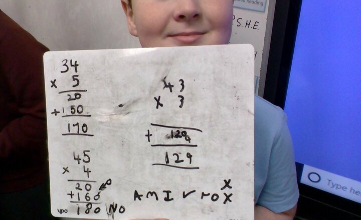 Image of We have been busy this morning in Year 4, we have been multiplying 2 digit by 1 digit numbers using place value counters and grids.