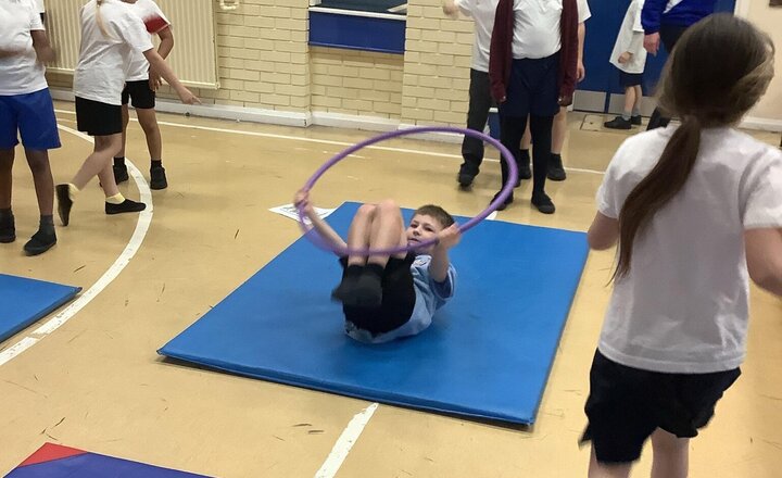 Image of This week in PE we have warmed up by stretching and playing games. Then we used various equipment to support us with a forward roll. Well done, Year 3!