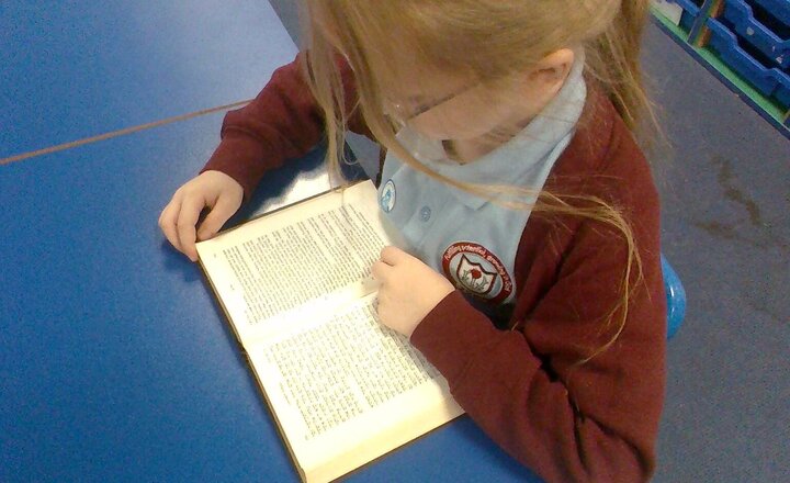 Image of Rev Alice brought her Bibles so we could look at them. Some were her very own, some belonged to her family and some from her church.