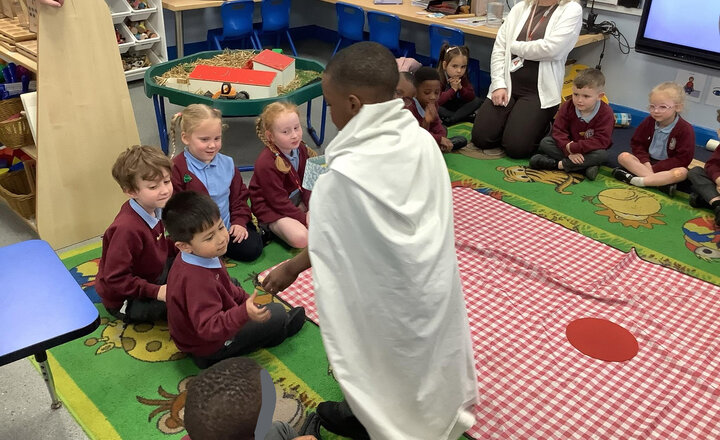 Image of In RE, Reception explored 'Special People' by role-playing 'Jesus Feeds the 5,000'. They learned how Jesus used just two fish and five loaves to feed the crowd, showing how his faith and kindness made him truly special. Great work, Reception!