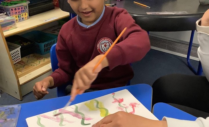 Image of In Art, we have been using water colours to create a flower meadow. We started by painting our background and then adding our stems and flowers!🌷🌻 They look amazing!