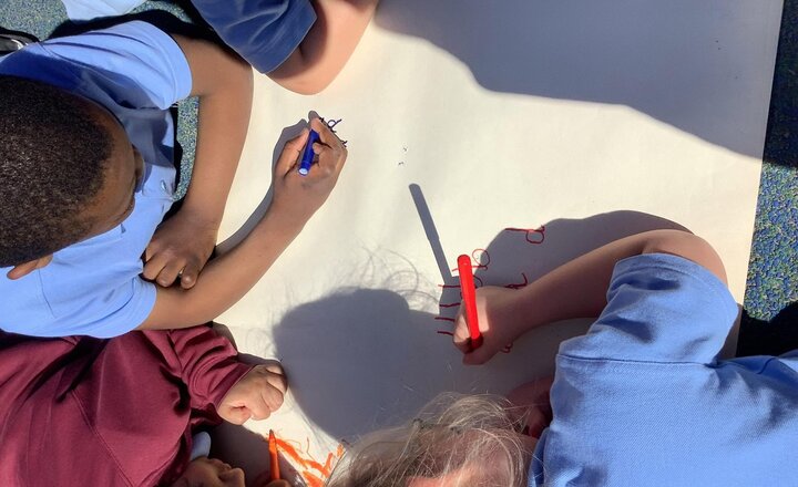 Image of Reception working really hard in Pen party - recapping our letter formations for our phonics sounds.