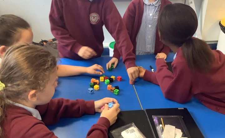 Image of Today in maths we are using teamwork to make a cube 🌈