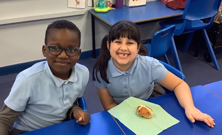 Image of Eating our delicious hot cross buns in RE. We are learning about the symbols of Easter.