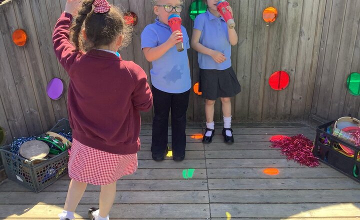 Image of Reception being fantastic busy bees outside in the sun last week!