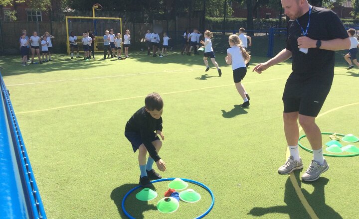 Image of Year 3 are developing skills for competitive games in PE.