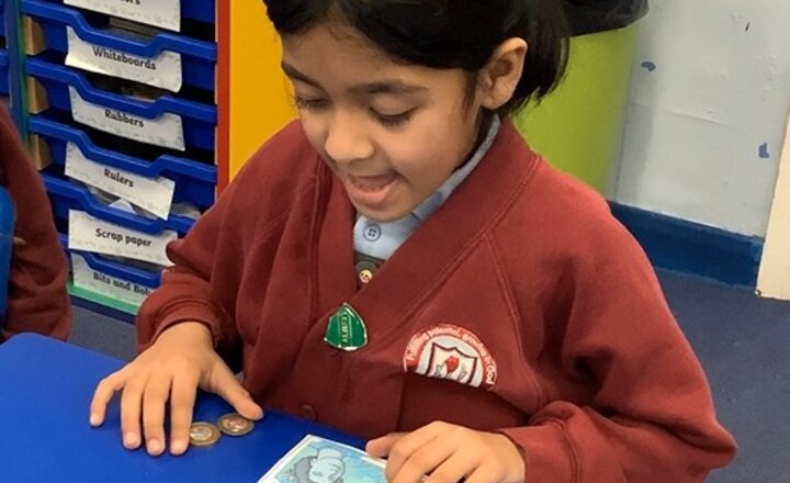 Image of Our Maths topic is money.  Yesterday we looked at making an amount. We recognised that we could make the same amount in different ways and how to make an amount using the fewest number of coins. Watch the video to hear our work in action. 