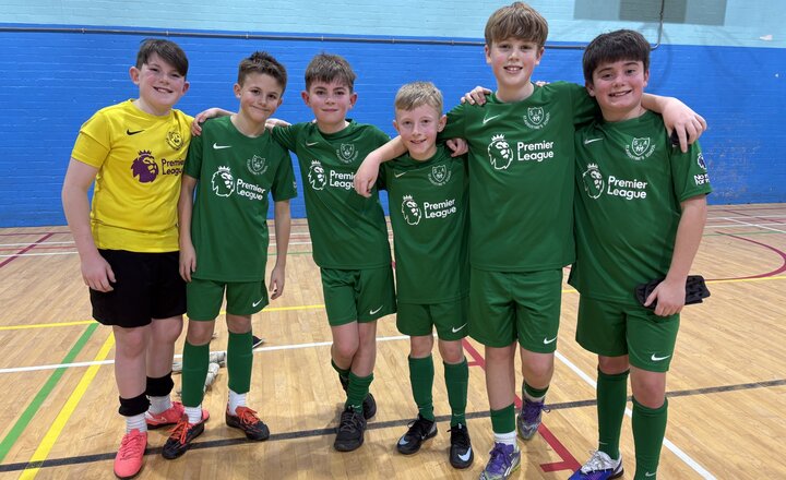 Year 6 football team celebrating their win