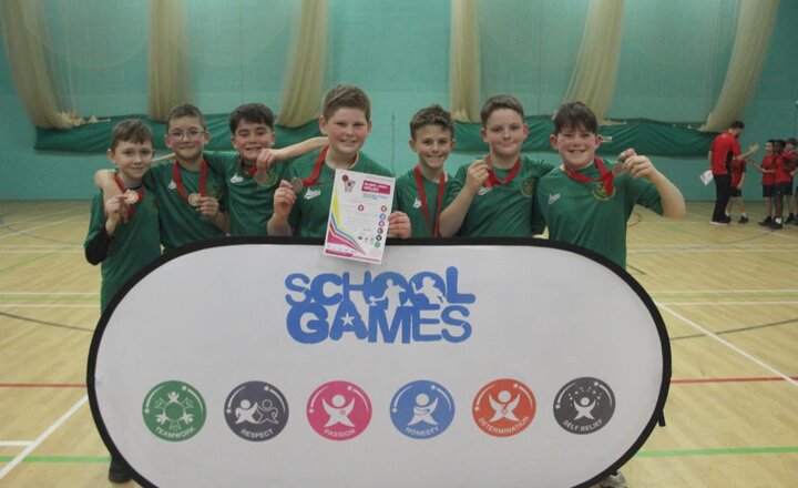 Year 6 basketball team showing off their medals from their Tees Valley competiton
