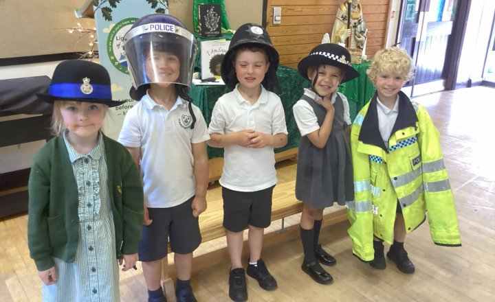St Augustine's pupils wearing Police uniforms during their special visit from a local officer