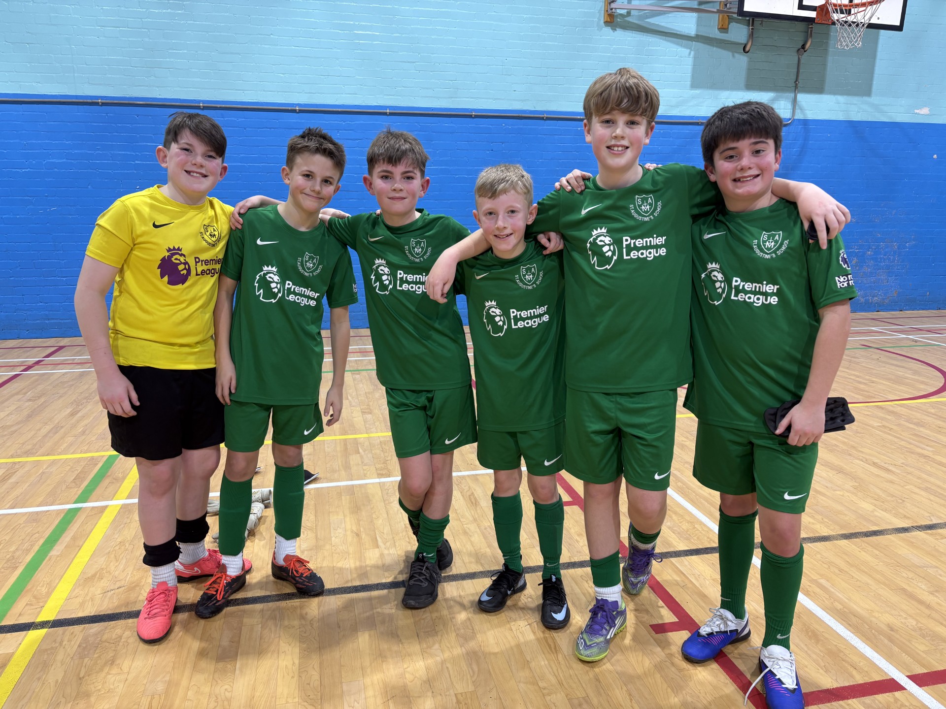 Year 6 football team celebrating their win