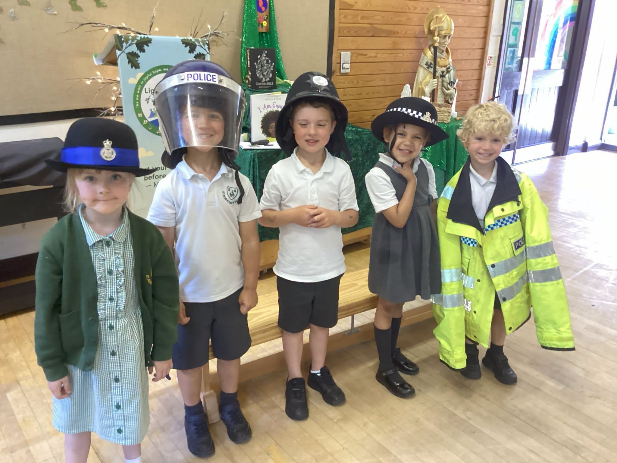 St Augustine's pupils wearing Police uniforms during their special visit from a local officer