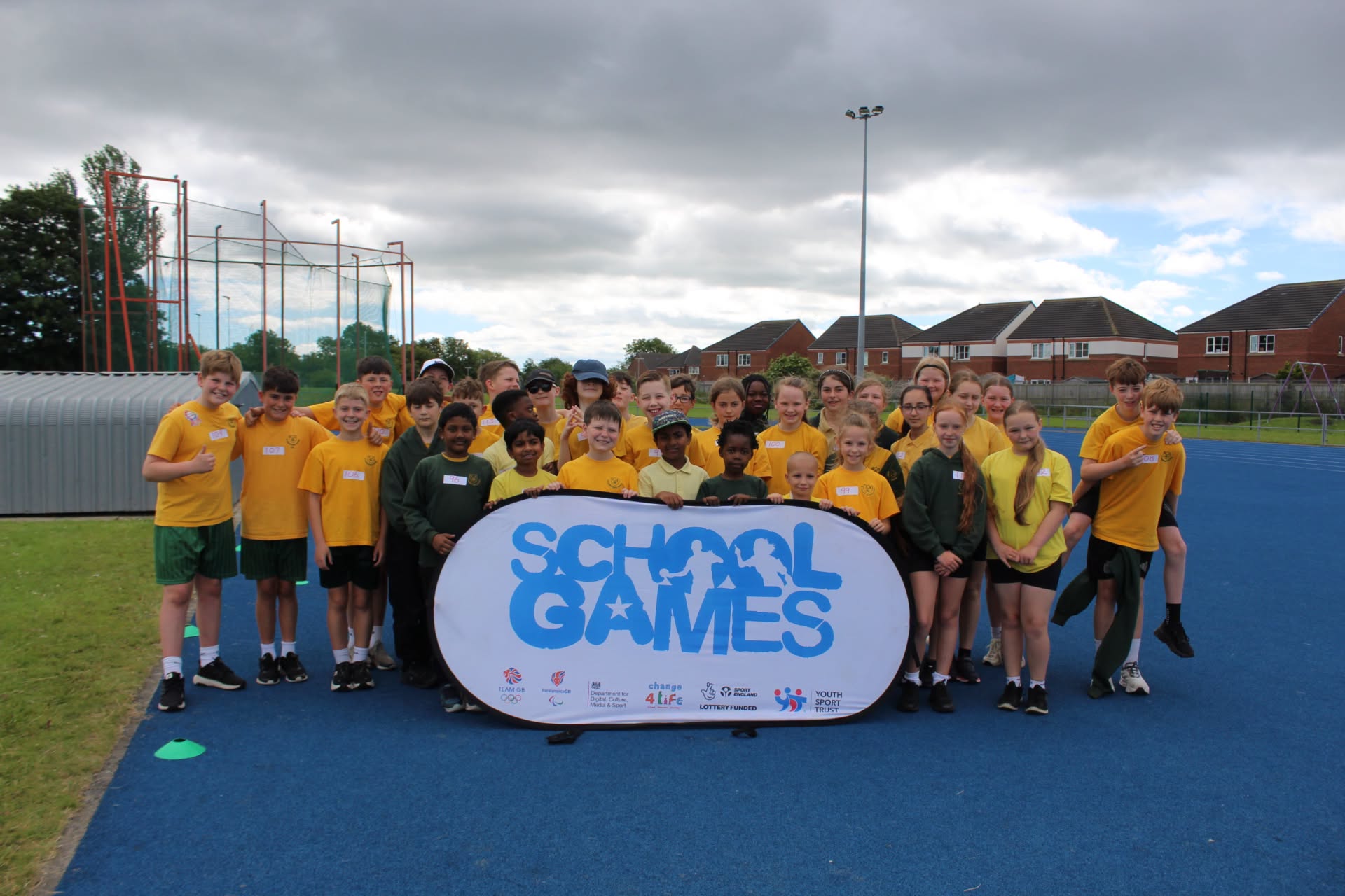 St Augustine's pupils celebrating the success of their Quadkids athletics event