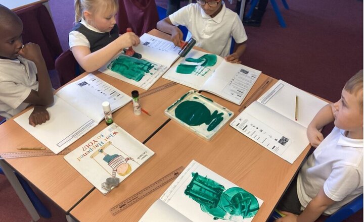 St. Bede’s Year 3 children practising printmaking techniques with rollers, experimenting with stamping, cross‑hatching, twisting, and varied rolling movements