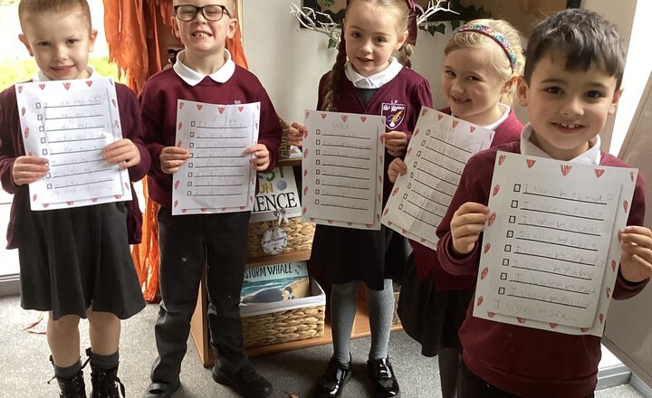 Pupils showing off their lists on what makes them special