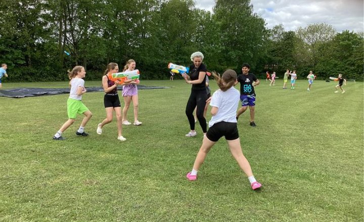 St Bede's pupils celebrate the end of their SATs with a water fight