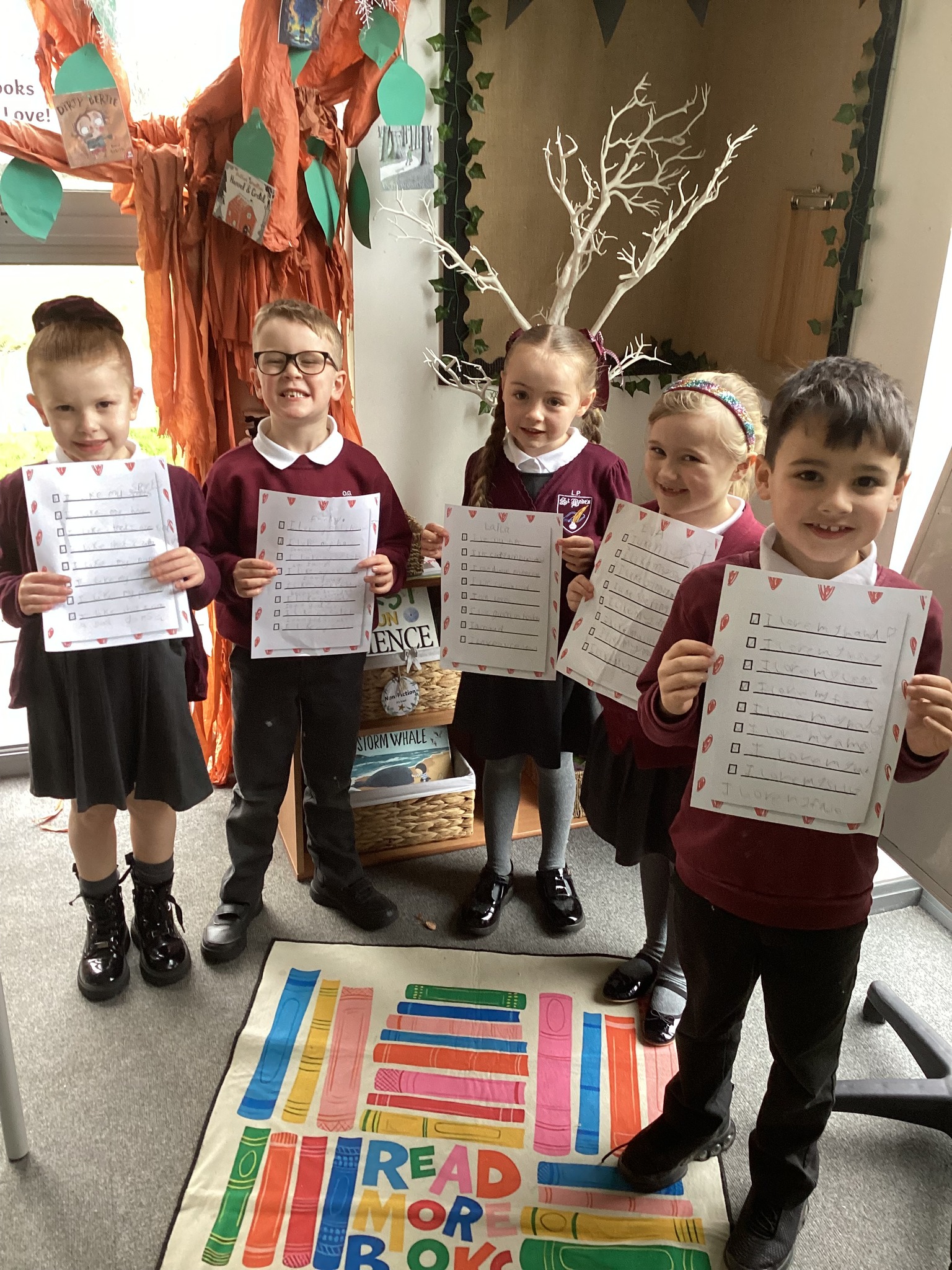 Pupils showing off their lists on what makes them special