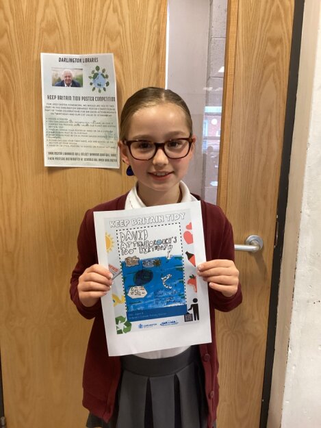 St Bede's pupil, Year 4 Ada, with her amazing winning entry for the Darlington Library competition