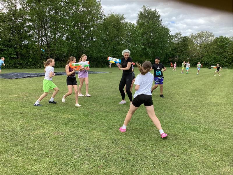 St Bede's pupils celebrate the end of their SATs with a water fight