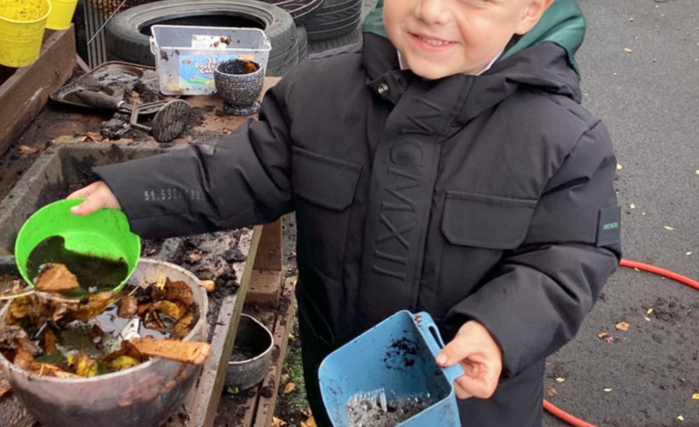 Image of Messy outside play in Nursery