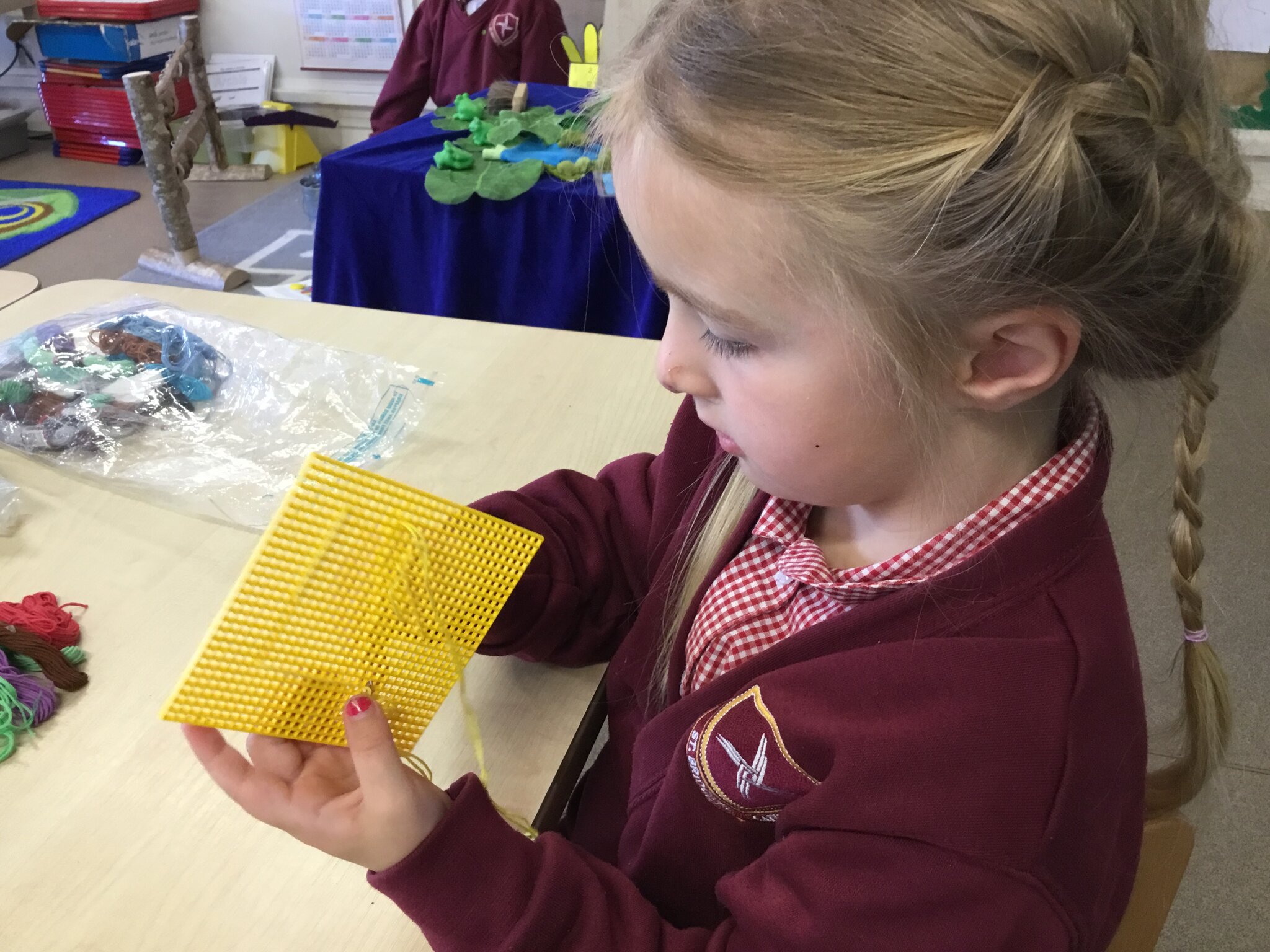 Image of Threading and sewing in Reception